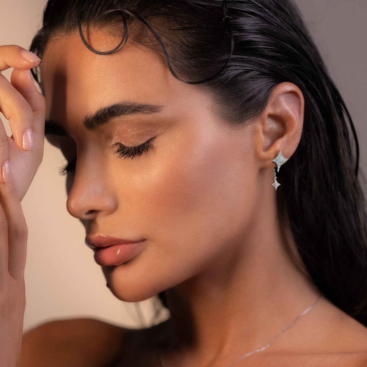 Sparkle earrings, model side view